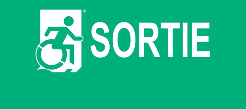 White on New Green Sortie Wheelie Man Wheelchair Accessible Exit Sign